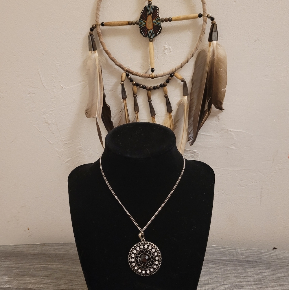 Black and silver pendant with long chain